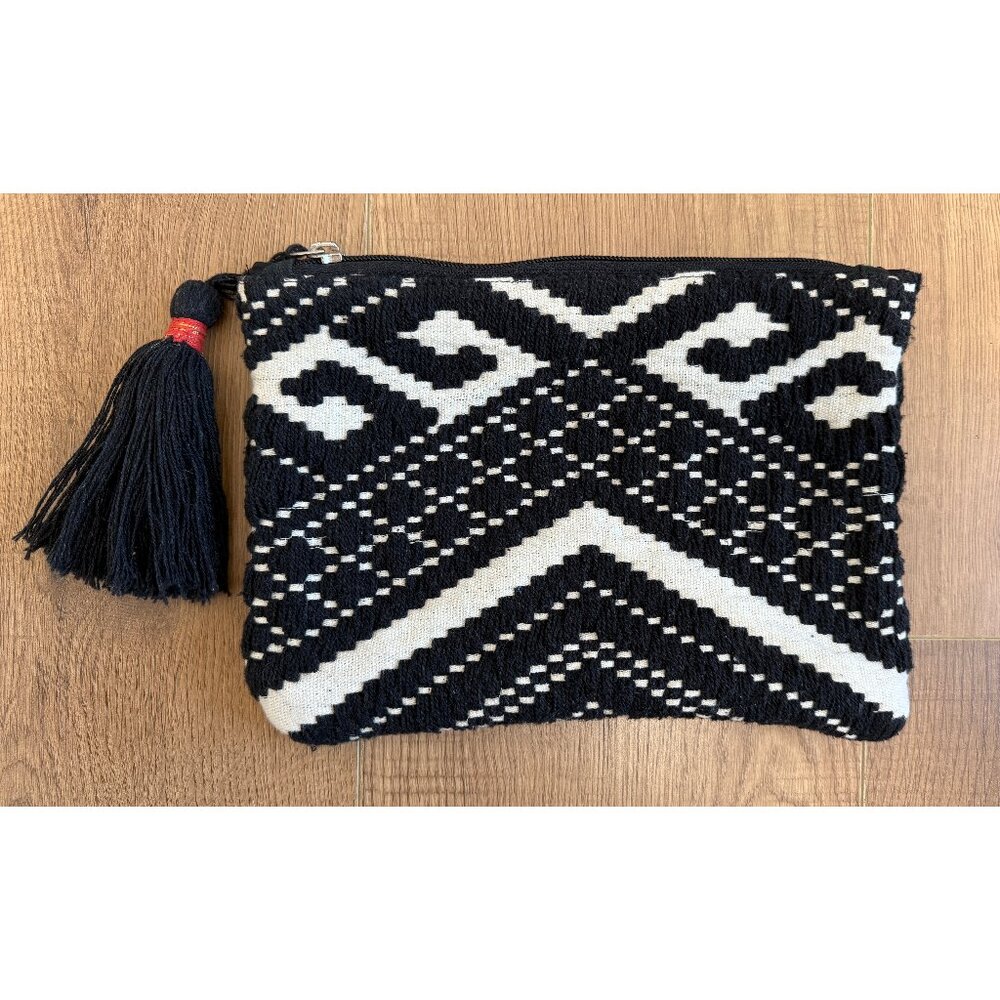 Woven black and white zippered pouch with tassel